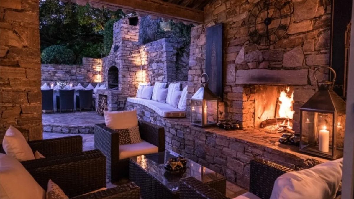 Cosy corner with fireplace and comfy seats in stone villa in the South of France